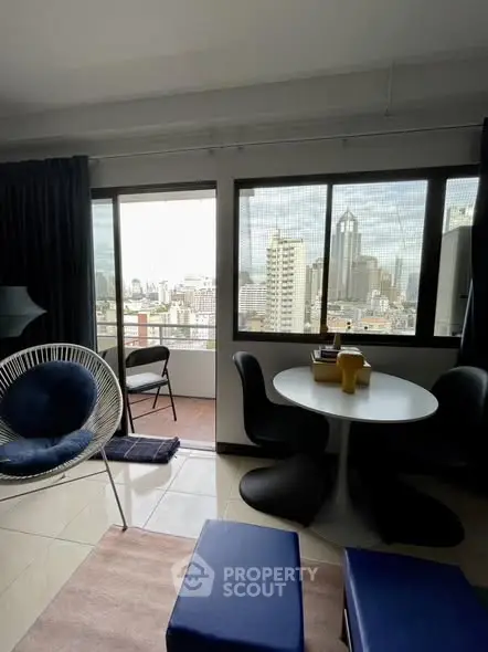 Modern living room with city view and stylish furniture, perfect for urban living.
