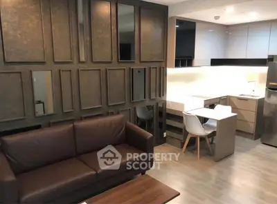 Modern living room with stylish decor and open kitchen layout