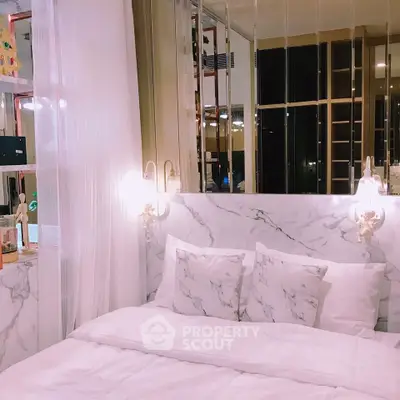 Luxurious bedroom with marble accents and elegant lighting