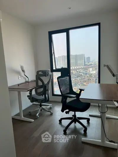 Modern study room with ergonomic chairs and city view, perfect for productivity and comfort.