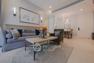 Modern living room with elegant decor and cozy seating area in a stylish apartment.