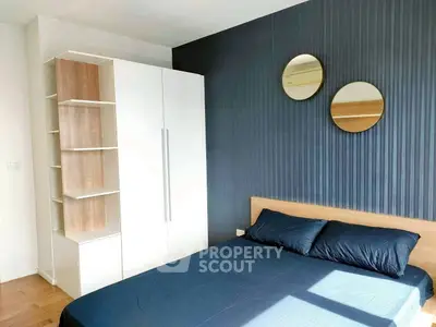 Modern bedroom with stylish decor and ample storage space