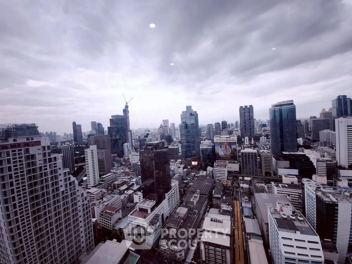 Stunning cityscape view from a high-rise building showcasing urban skyline and architecture.