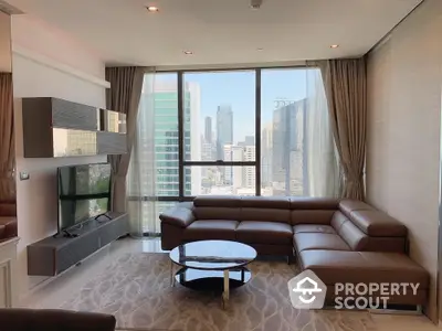 Luxurious modern living room with stunning city view and elegant furnishings.