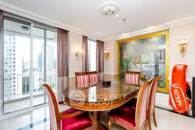 Elegant dining room with luxurious decor and city view balcony in high-rise apartment.