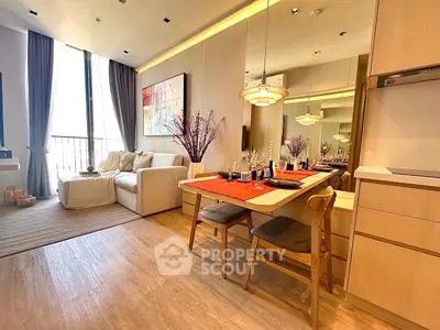 Modern living room with dining area, cozy sofa, and elegant decor