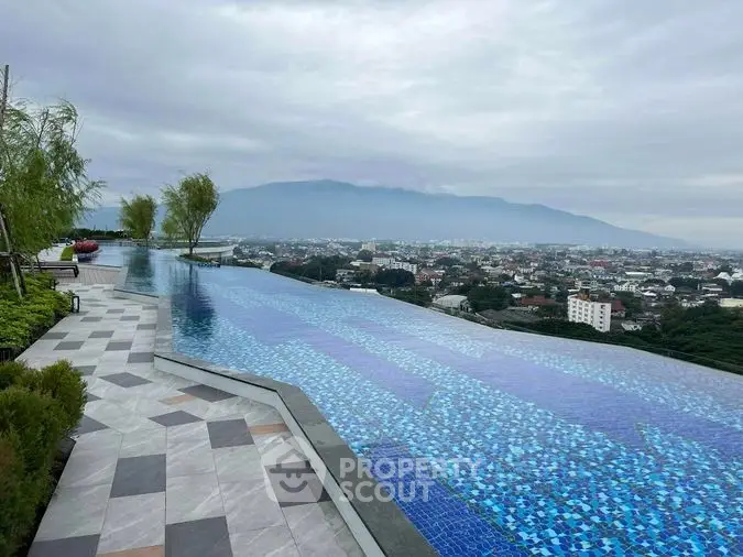 Luxurious infinity pool with breathtaking panoramic city views, offering a serene escape amidst lush greenery and opulent amenities.