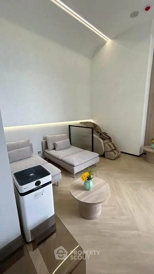 Modern living room with stylish furniture and air purifier, featuring a cozy seating area and elegant decor.