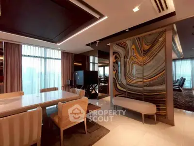 Luxurious modern living room with elegant dining area and artistic wall design