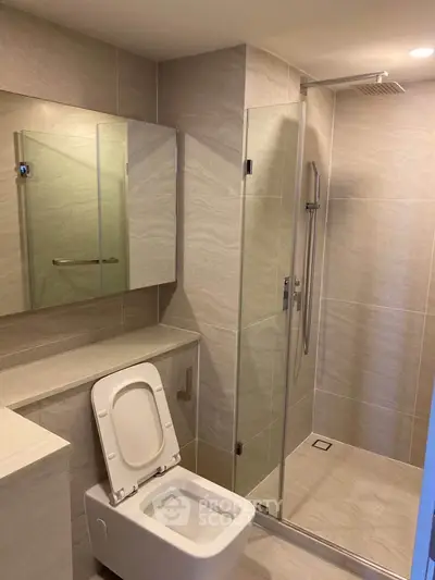 Modern bathroom with sleek shower and contemporary toilet design