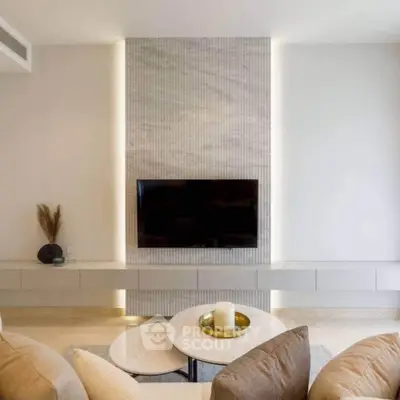 Elegant living room with modern TV setup and stylish decor