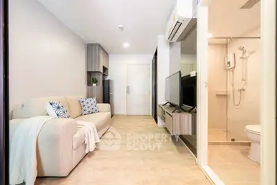 Modern living room with cozy sofa and stylish decor in a contemporary apartment.