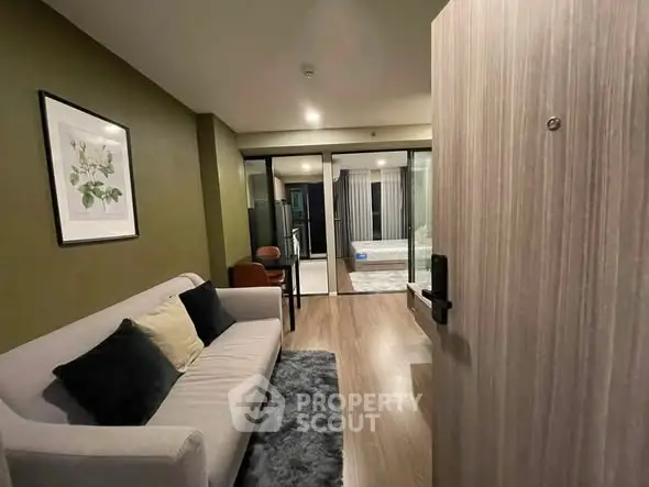 Modern living room with stylish decor and cozy seating area in a contemporary apartment.