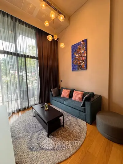 Stylish living room with modern decor and large windows for natural light.