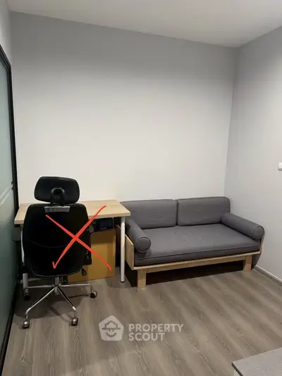 Modern study room with sleek desk and comfortable sofa, perfect for productivity and relaxation.