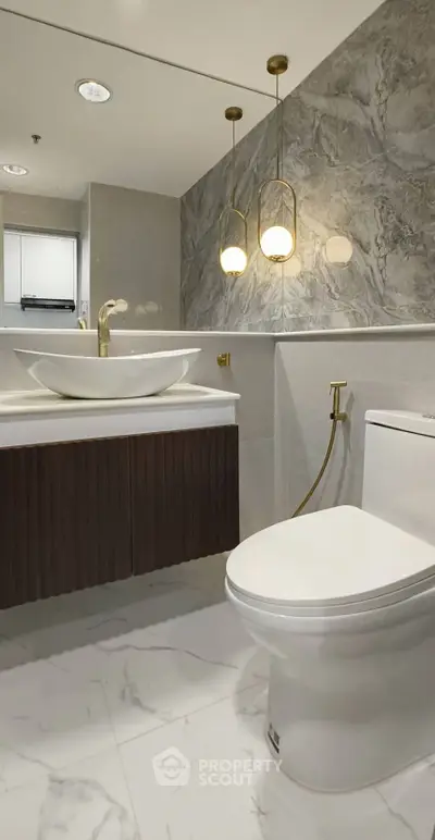 Luxurious modern bathroom with elegant fixtures and marble accents