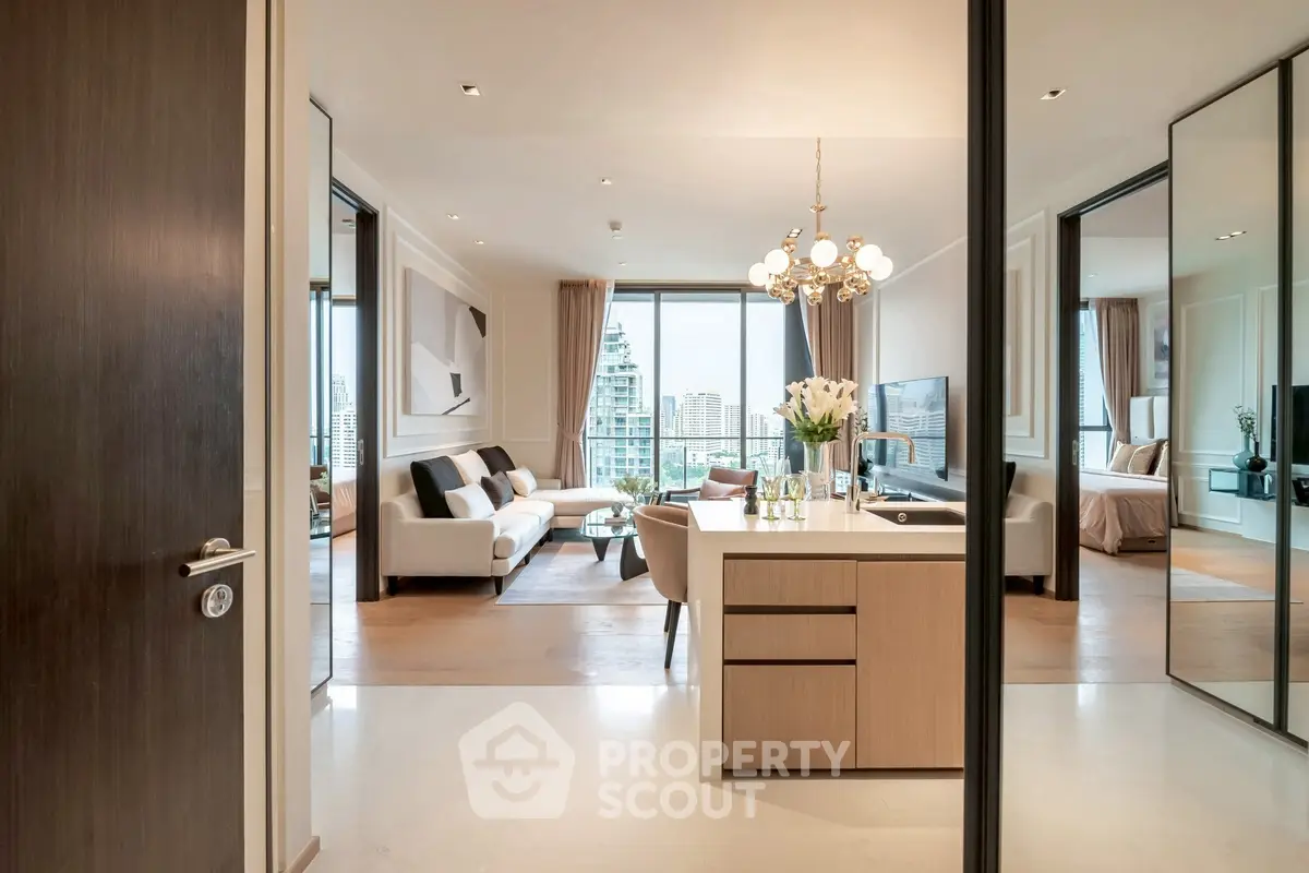 Luxurious open-plan living room with modern decor and stunning city view.