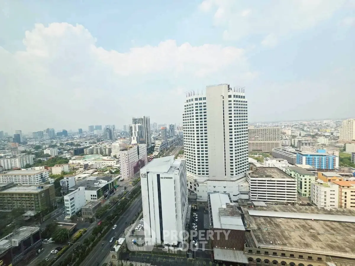 Stunning cityscape view from high-rise building showcasing urban skyline and architectural diversity.