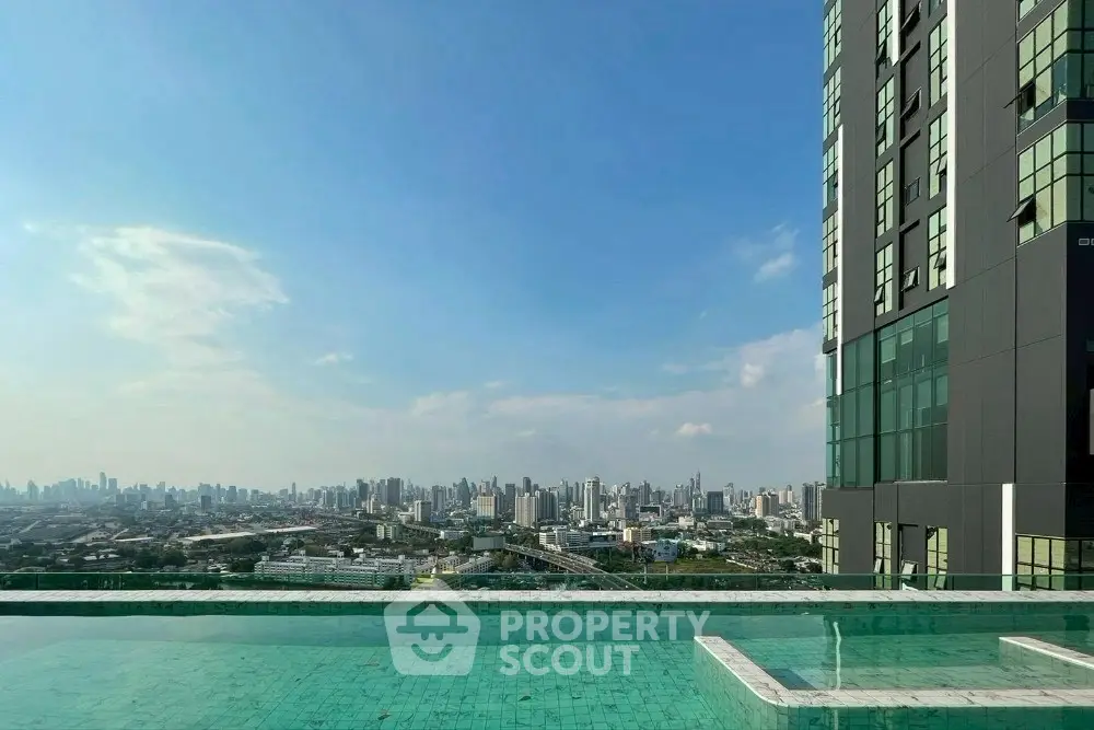 Stunning cityscape view from a modern high-rise building with a luxurious rooftop pool.