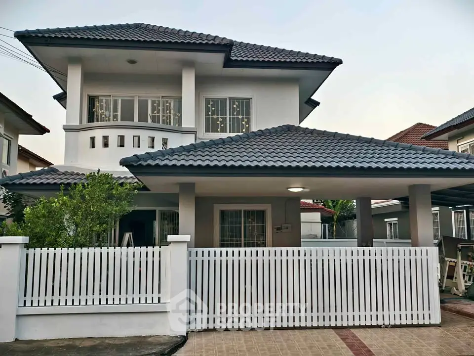 Charming two-story house with modern design and spacious front yard