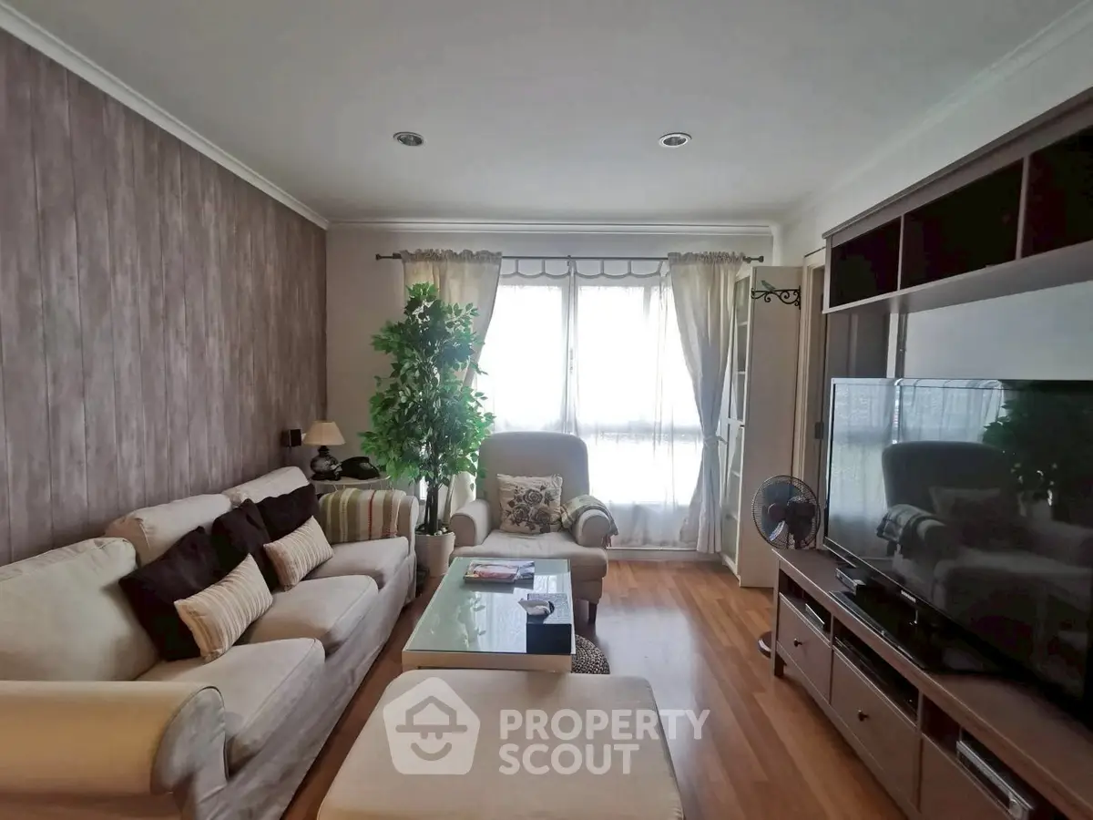 Cozy living room with large TV and comfortable seating