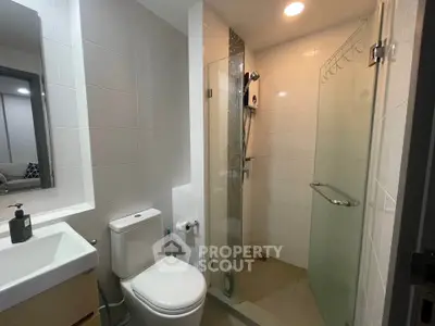 Modern bathroom with glass shower and sleek fixtures