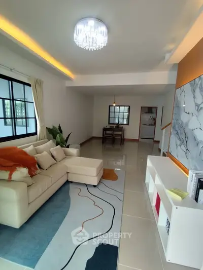 Spacious modern living room with elegant decor and natural light