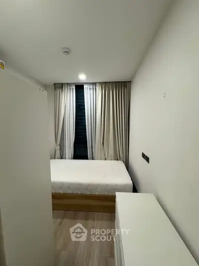 Cozy minimalist bedroom with modern decor and natural light