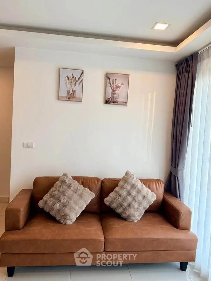 Stylish living room with modern brown leather sofa and elegant decor