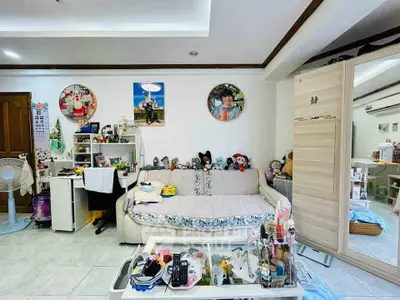 Cozy living room with plush sofa and playful decor, perfect for family relaxation.