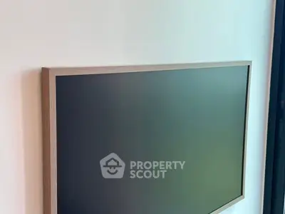 Modern wall-mounted flat screen TV in a stylish interior setting