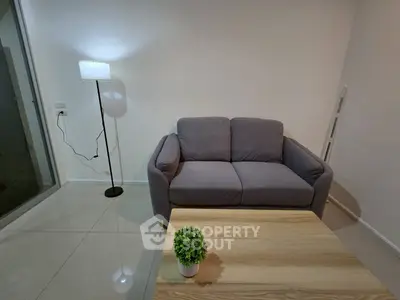 Cozy living room with modern sofa and stylish lamp