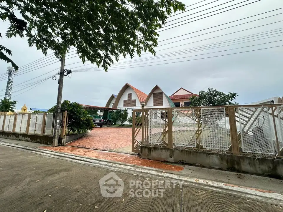 Spacious property with unique architecture and gated entrance, ideal for privacy and security.