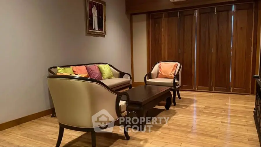 Elegant living room with wooden flooring and classic furniture