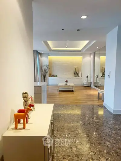 Spacious modern living room with elegant decor and marble flooring