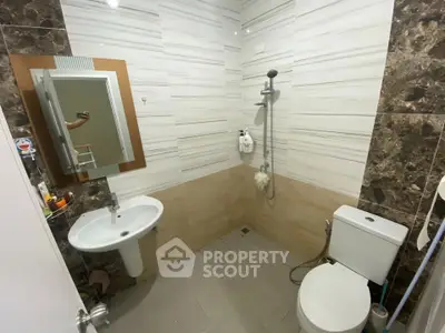 Modern bathroom with sleek tiles and shower area