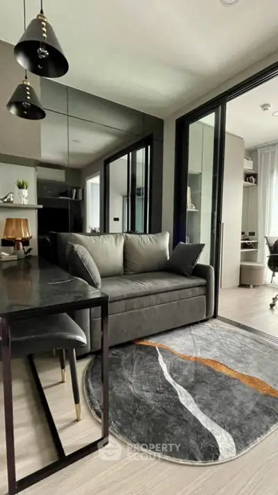 Modern living room with sleek furniture and stylish decor in a contemporary apartment.
