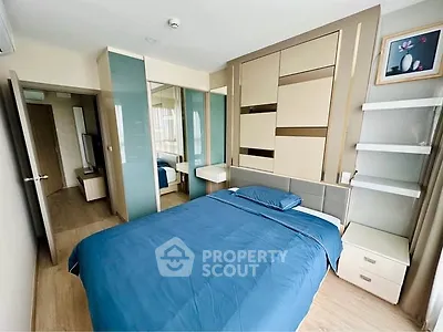 Modern bedroom with stylish decor and ample storage space