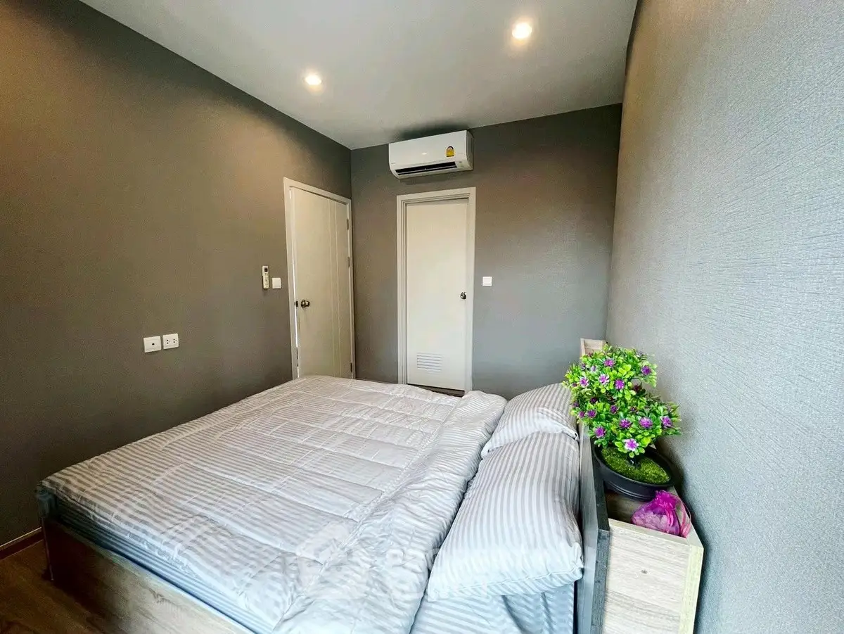 Modern bedroom with sleek design and air conditioning unit