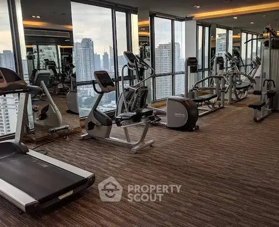 Modern gym with city view and state-of-the-art fitness equipment