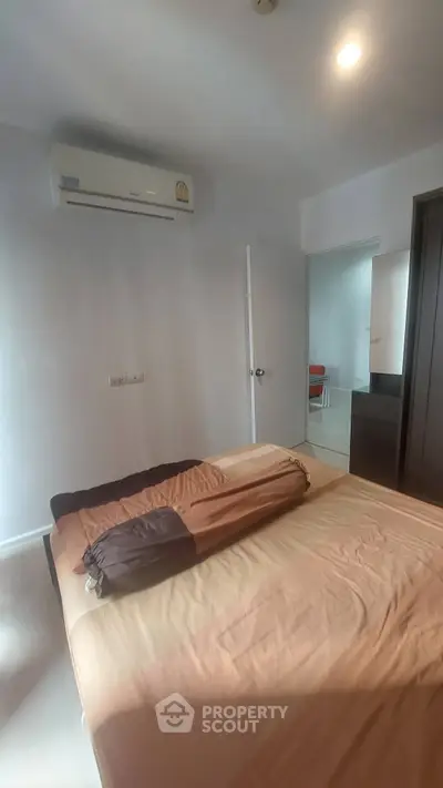 Cozy bedroom with air conditioning and modern decor in a stylish apartment.