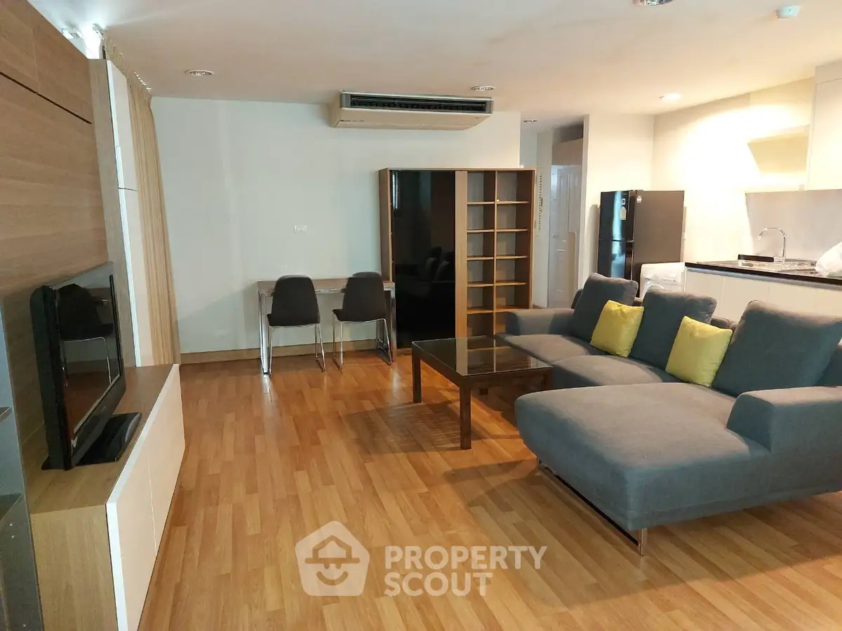 Spacious modern living room with open kitchen and stylish furniture