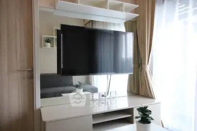 Modern living room with sleek TV setup and stylish decor