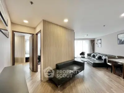 Spacious modern living room with elegant decor and ample natural light