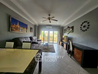 Spacious living room with modern decor and large windows for natural light.