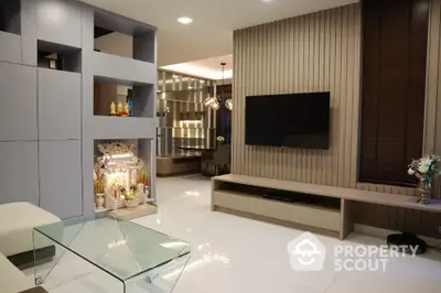 Modern living room with sleek design and built-in TV unit