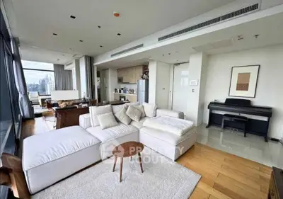 Spacious modern living room with city view and elegant furnishings