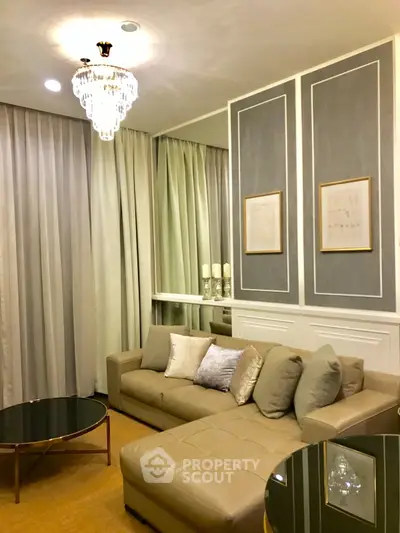 Elegant living room with plush sofa, chic chandelier, and stylish decor