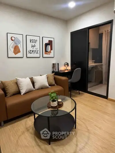 Modern living room with stylish decor and cozy seating area, perfect for relaxation and entertaining.