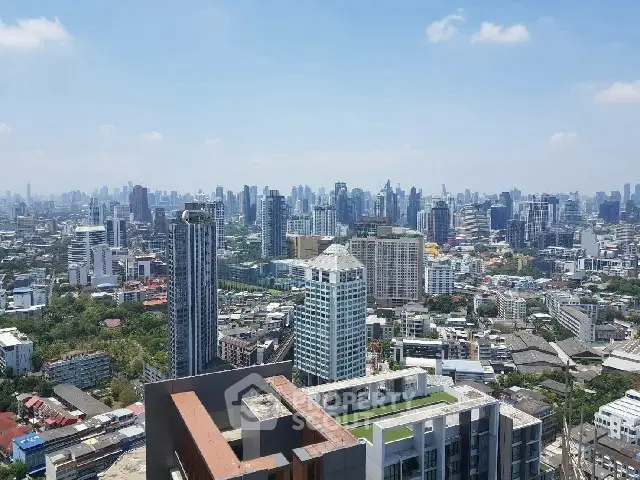 Stunning cityscape view from a high-rise building showcasing urban skyline and modern architecture.